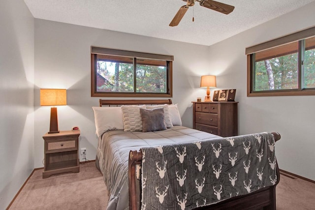 1167 Tee Trl, Nekoosa, WI 54457 - carpeted bedroom featuring a textured ceiling and ceiling fan