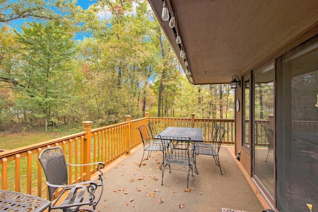 1167 Tee Trl, Nekoosa, WI 54457 - view of patio featuring outdoor dining area and a wooden deck