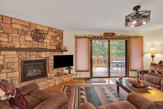 1167 Tee Trl, Nekoosa, WI 54457 - living area featuring wood finished floors, a textured ceiling, and a fireplace