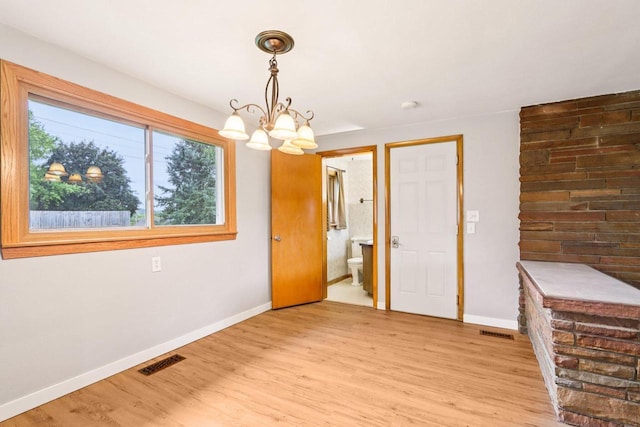 W262S3159 View Dr, Waukesha, WI 53189 - unfurnished dining area with a chandelier and light wood-style floors