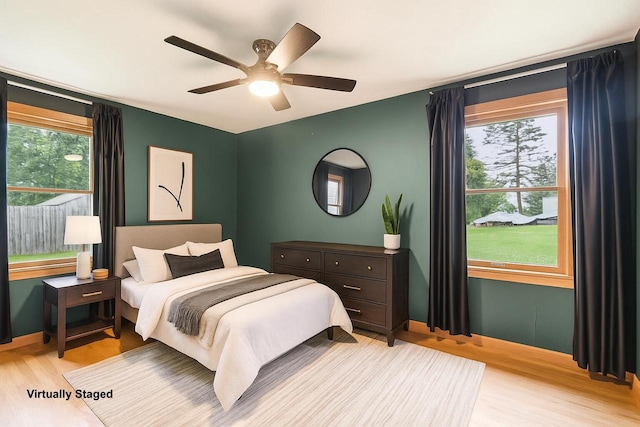 W262S3159 View Dr, Waukesha, WI 53189 - bedroom with light wood finished floors, multiple windows, and ceiling fan