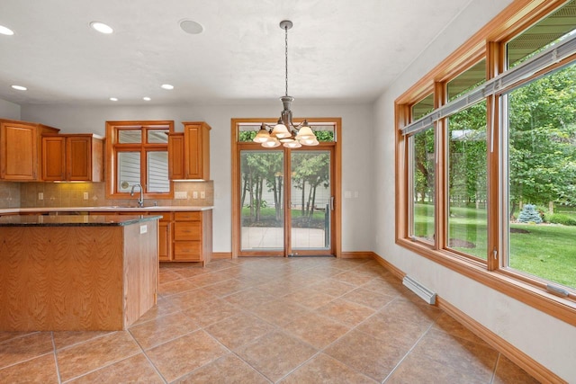 N3520 Range Ct, Freedom, WI 54913 - kitchen featuring a chandelier, tasteful backsplash, recessed lighting, hanging light fixtures, and brown cabinetry