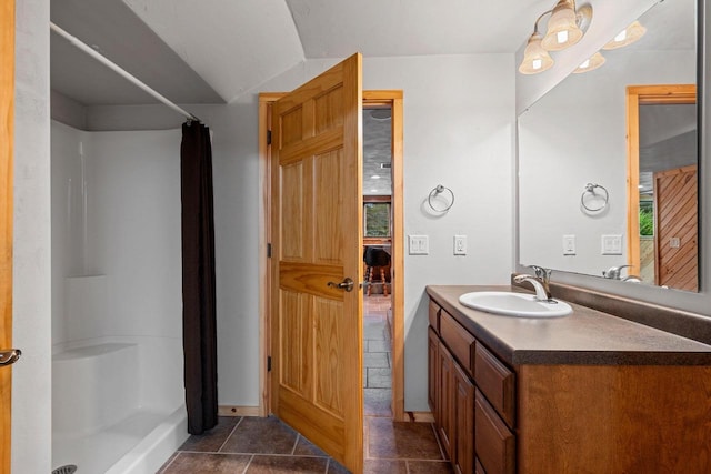 N3520 Range Ct, Freedom, WI 54913 - bathroom featuring a shower with shower curtain, vanity, vaulted ceiling, and tile patterned floors