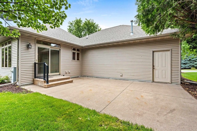 N3520 Range Ct, Freedom, WI 54913 - back of house with a patio area, roof with shingles, and a yard