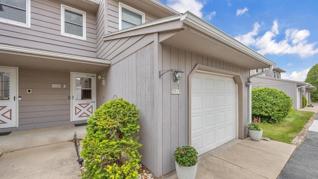 3515 Willow Cir, Sheboygan, WI 53083 - property entrance with driveway and an attached garage