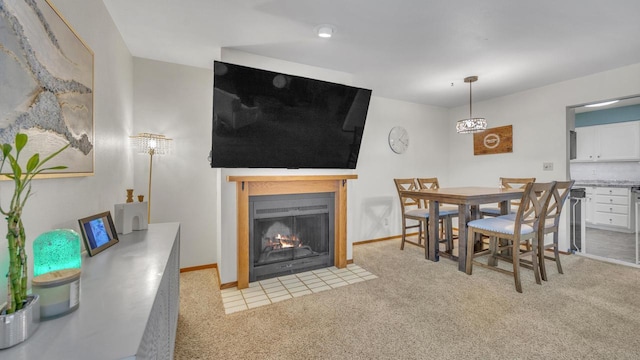 3515 Willow Cir, Sheboygan, WI 53083 - dining room featuring a fireplace with flush hearth and light carpet