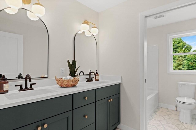 1108 Heritage Ct, Waunakee, WI 53597 - bathroom with double vanity, tile patterned flooring, and  shower combination