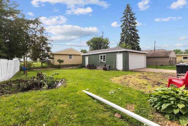 1012 Grove St, Oshkosh, WI 54901 - view of yard featuring a garage and an outbuilding
