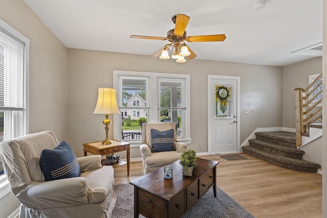 308 Van St, Neenah, WI 54956 - living room featuring stairway, ceiling fan, and light wood-style floors