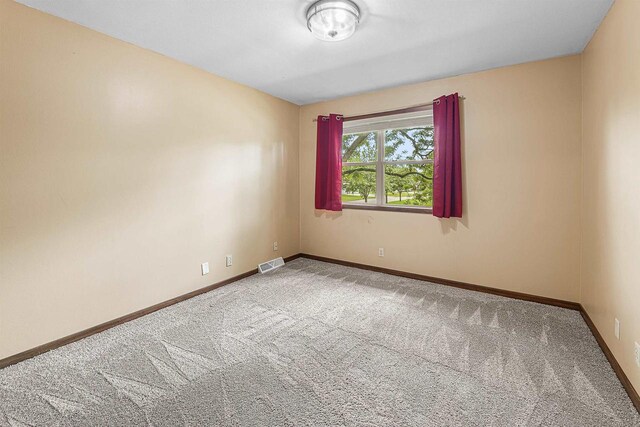 241 Bayberry Ln, Fond Du Lac, WI 54935 - carpeted empty room with baseboards