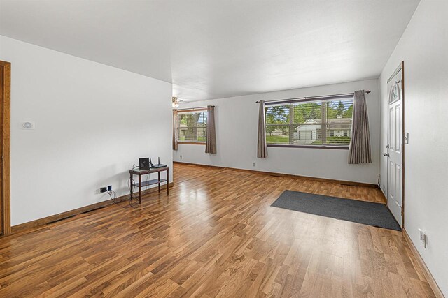 241 Bayberry Ln, Fond Du Lac, WI 54935 - unfurnished room featuring wood finished floors