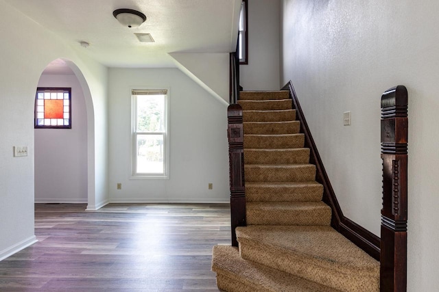 524 W New York Ave, Oshkosh, WI 54901 - stairway with arched walkways and wood finished floors