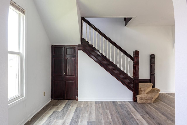 524 W New York Ave, Oshkosh, WI 54901 - staircase featuring wood finished floors and healthy amount of natural light