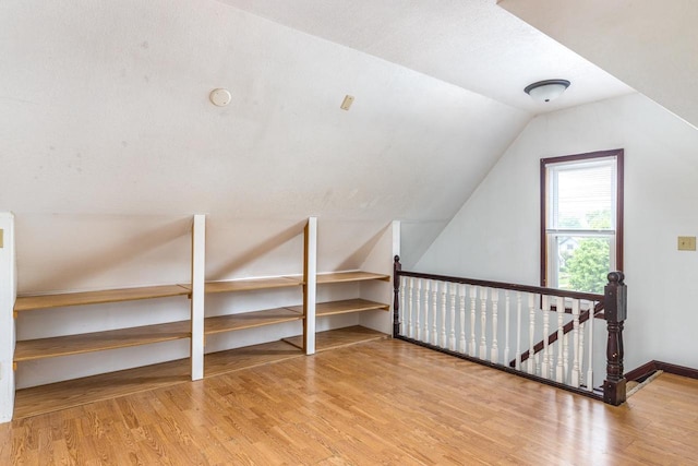524 W New York Ave, Oshkosh, WI 54901 - bonus room featuring wood finished floors and lofted ceiling