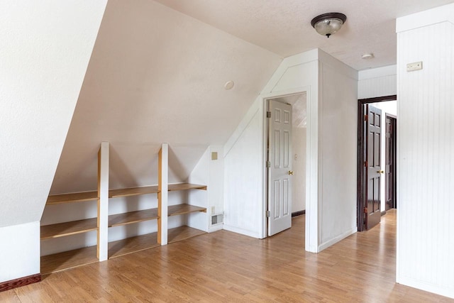 524 W New York Ave, Oshkosh, WI 54901 - bonus room with light wood-style flooring and lofted ceiling