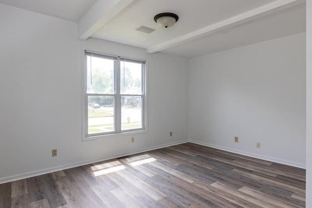 524 W New York Ave, Oshkosh, WI 54901 - empty room with beam ceiling and dark wood finished floors