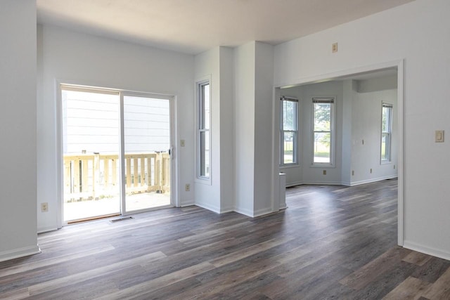 524 W New York Ave, Oshkosh, WI 54901 - unfurnished room with dark wood-style floors and baseboards