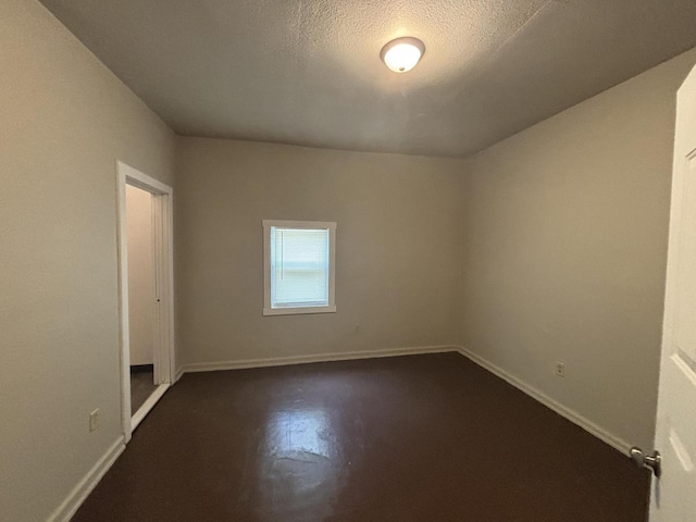 2809 W Clark St Unit 2811, Milwaukee, WI 53210 - spare room featuring baseboards and a textured ceiling