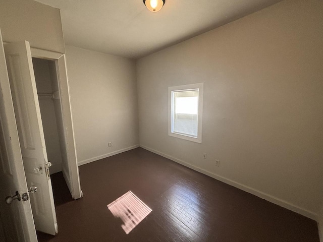 2809 W Clark St Unit 2811, Milwaukee, WI 53210 - unfurnished bedroom featuring baseboards and dark wood finished floors