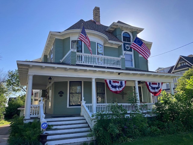 1133 Algoma Blvd, Oshkosh, WI 54901 - victorian-style house with a porch and a chimney