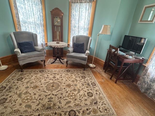 1133 Algoma Blvd, Oshkosh, WI 54901 - living area featuring wood finished floors and baseboards