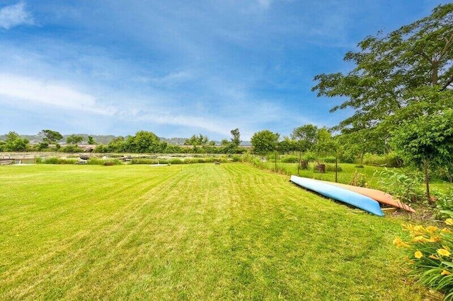 456 W Wisconsin Ave, Pewaukee, WI 53072 - view of home's community with a yard