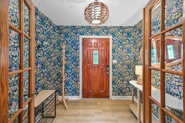 456 W Wisconsin Ave, Pewaukee, WI 53072 - foyer entrance with wallpapered walls and wood finished floors