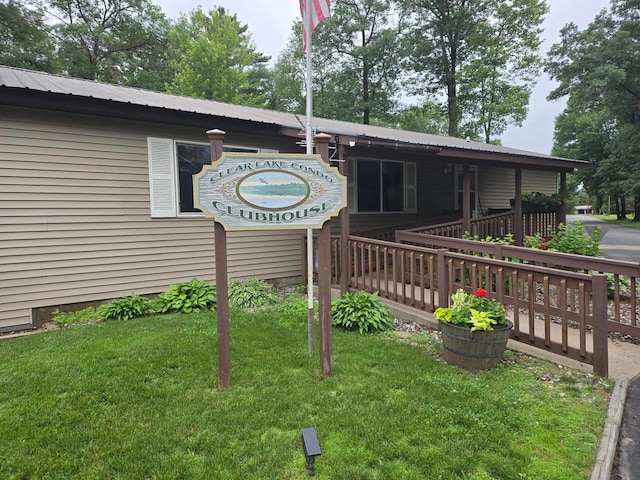 N11445 County Road A, Tomahawk, WI 54487 - view of front of house featuring a front lawn, a metal roof, and crawl space