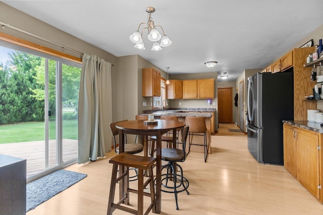 362 Dakota Lee Way, Omro, WI 54963 - dining area featuring light wood finished floors and a chandelier