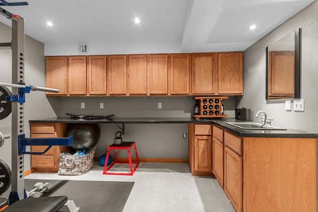 362 Dakota Lee Way, Omro, WI 54963 - kitchen with dark countertops, brown cabinets, light carpet, and recessed lighting