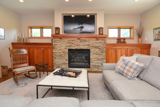 6833 Phil Lewis Way, Middleton, WI 53562 - living room featuring recessed lighting, wood finished floors, and a fireplace