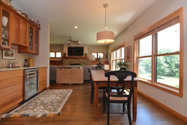 6833 Phil Lewis Way, Middleton, WI 53562 - dining space with beverage cooler, dark wood-type flooring, a dry bar, recessed lighting, and ceiling fan