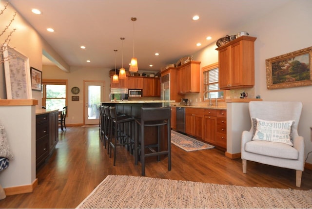 6833 Phil Lewis Way, Middleton, WI 53562 - kitchen with appliances with stainless steel finishes, light countertops, dark wood finished floors, and recessed lighting