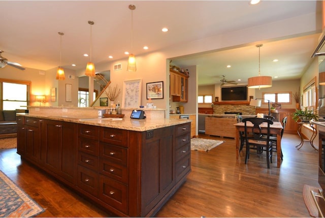6833 Phil Lewis Way, Middleton, WI 53562 - kitchen featuring ceiling fan, open floor plan, dark wood-style flooring, recessed lighting, and decorative light fixtures