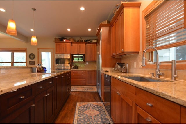 6833 Phil Lewis Way, Middleton, WI 53562 - kitchen featuring appliances with stainless steel finishes, dark wood-type flooring, plenty of natural light, recessed lighting, and tasteful backsplash