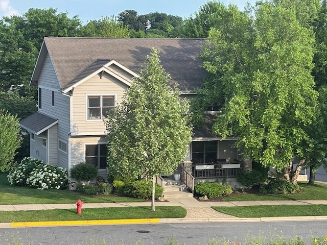 6833 Phil Lewis Way, Middleton, WI 53562 - view of property hidden behind natural elements with covered porch and a shingled roof