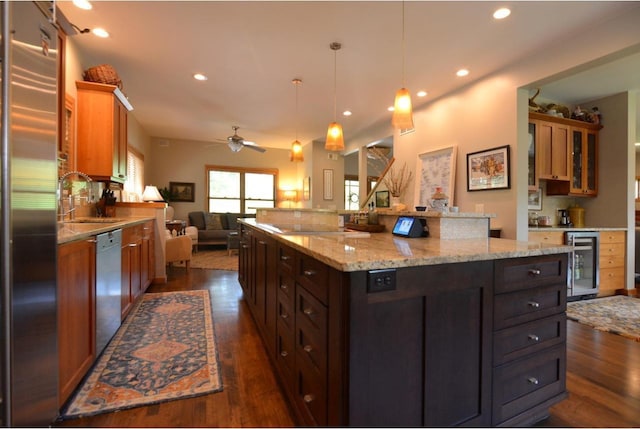 6833 Phil Lewis Way, Middleton, WI 53562 - kitchen with beverage cooler, dishwashing machine, open floor plan, high end refrigerator, and dark wood-style flooring