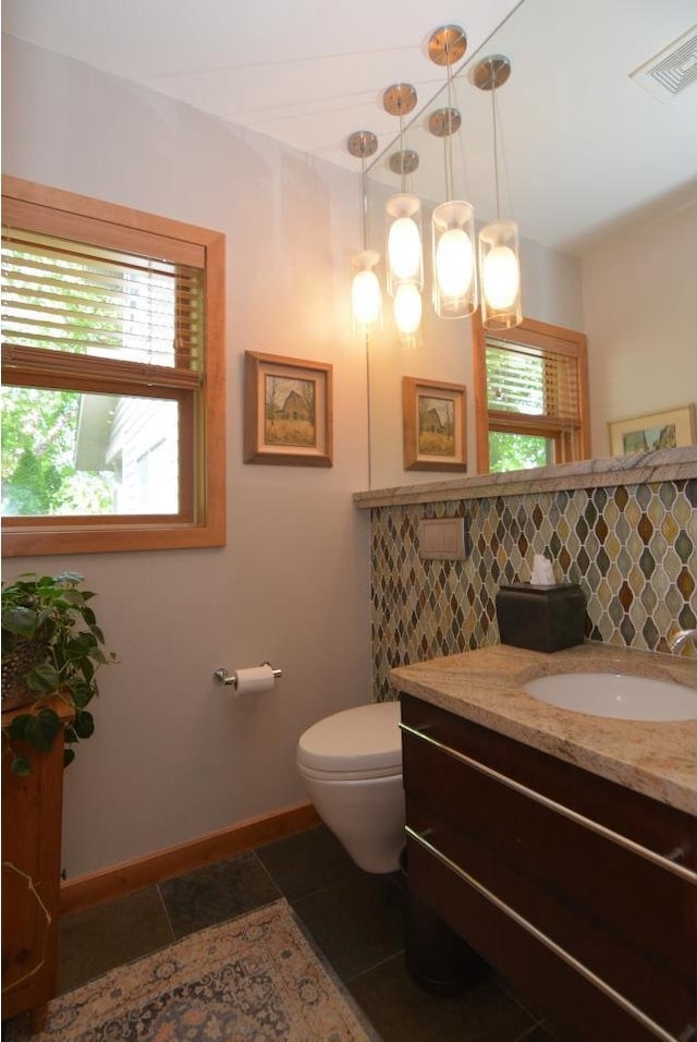 6833 Phil Lewis Way, Middleton, WI 53562 - bathroom with healthy amount of natural light, vanity, tile patterned flooring, and tasteful backsplash