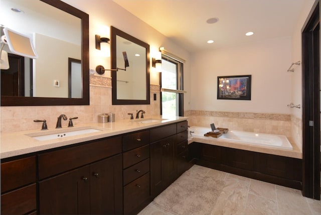 6833 Phil Lewis Way, Middleton, WI 53562 - full bath featuring double vanity, a garden tub, and recessed lighting