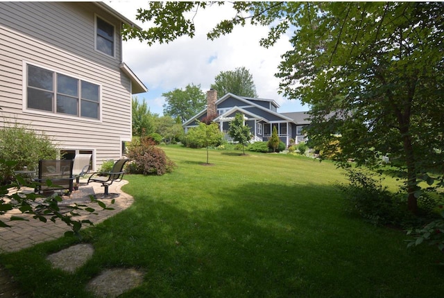 6833 Phil Lewis Way, Middleton, WI 53562 - view of grassy yard with a patio area