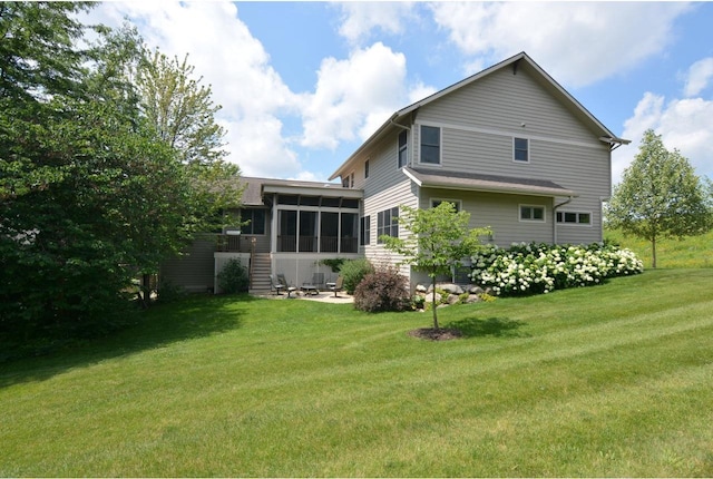 6833 Phil Lewis Way, Middleton, WI 53562 - back of house featuring a sunroom and a yard