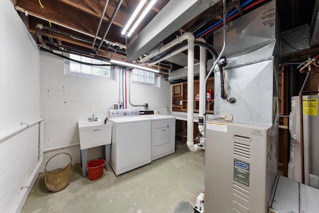 5825 N Bay Ridge Ave, Whitefish Bay, WI 53217 - basement featuring washing machine and dryer, electric water heater, and heating unit