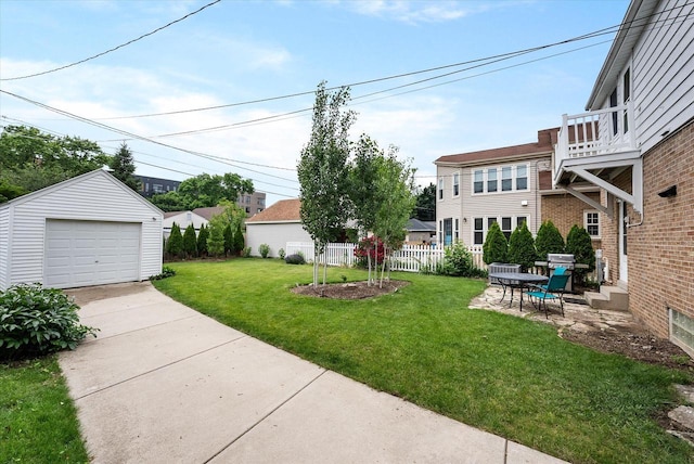 5825 N Bay Ridge Ave, Whitefish Bay, WI 53217 - view of yard with a detached garage, an outdoor structure, and driveway