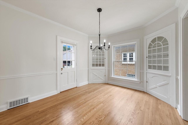 5825 N Bay Ridge Ave, Whitefish Bay, WI 53217 - unfurnished dining area featuring a chandelier, light wood-style flooring, and ornamental molding