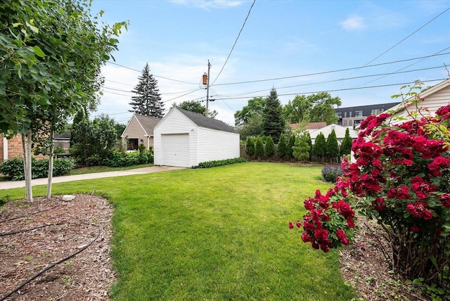 5825 N Bay Ridge Ave, Whitefish Bay, WI 53217 - view of green lawn featuring driveway, an outbuilding, and a garage