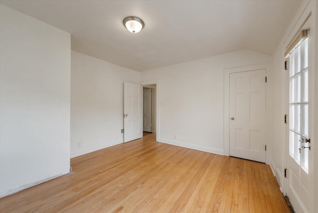 5825 N Bay Ridge Ave, Whitefish Bay, WI 53217 - empty room featuring light wood-style flooring and lofted ceiling