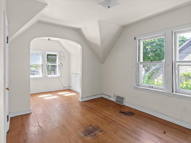 4134 N 46th St, Milwaukee, WI 53216 - bonus room with plenty of natural light, hardwood / wood-style flooring, vaulted ceiling, and arched walkways