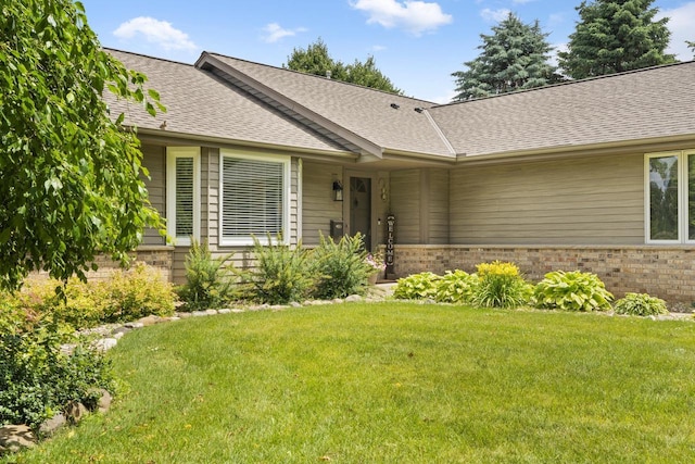 S52W23066 Hunters Holw, Waukesha, WI 53189 - ranch-style home with brick siding, a front yard, and a shingled roof