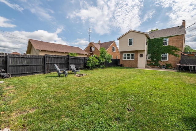 7550 26th Ave, Kenosha, WI 53143 - fenced backyard featuring a trampoline