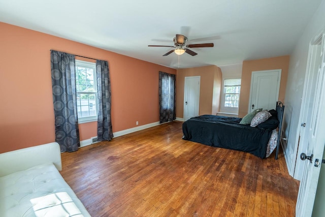 7550 26th Ave, Kenosha, WI 53143 - bedroom featuring wood finished floors, multiple windows, and a ceiling fan